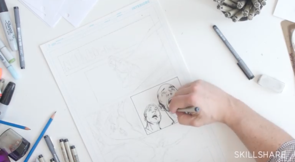Skillshare instructor Phil Jimenez sketches out a pane of a comic book.