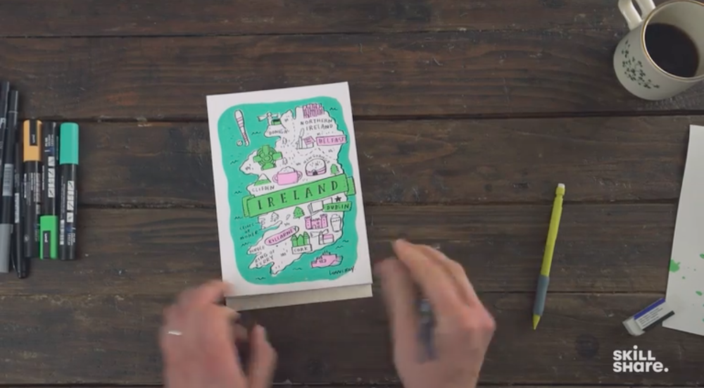 Skillshare instructor Mike Lowery shows off an illustration of a hand-drawn map of Ireland.