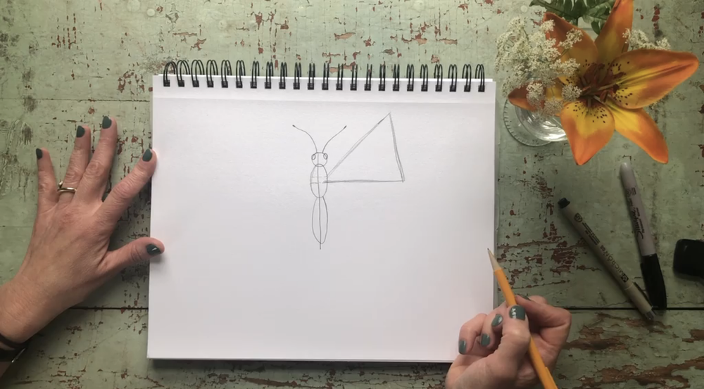 Use the marks from before to draw a triangle for the top wing.