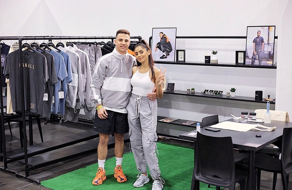 Tyler Bowman and his fiancee, Daiana, in their M A N A L L booth at the Agenda Show