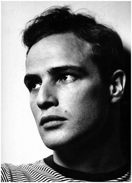 Ask your subject to turn towards the light to capture interesting highlights and shadows.  Marlon Brando , Phillippe Halsman, 1950 ( image source )