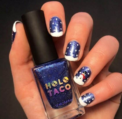 Image via Instagram Add a snowman (or woman!) to one nail on each hand for an extra fun manicure.