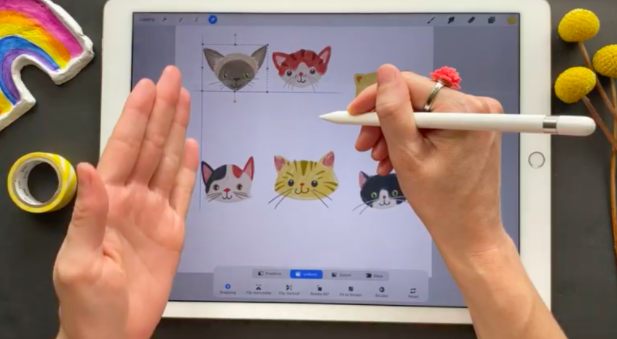 As Brook Glaser lines up these cat faces, Procreate 5X generates guidelines and helps “snap” them into place.