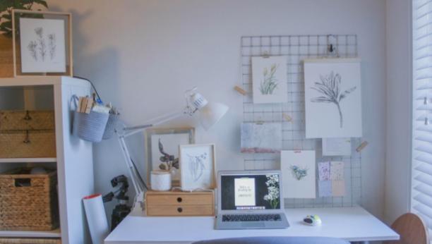 This small yet functional workspace incorporates natural lighting, functional storage, and a clutter-free work surface. 