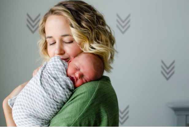 Asking parents to bring props—like this cozy swaddle—to a newborn DIY photoshoot can help keep babies comfortable and calm. 