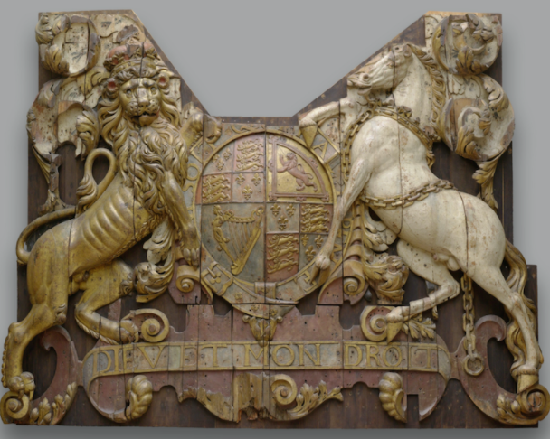 This mixed materials carving once adorned the helm of King George II’s flagship of the Royal Charles.