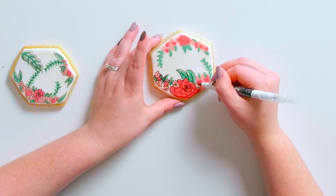 Edible markers add a fun, precise touch to cookie decoration.