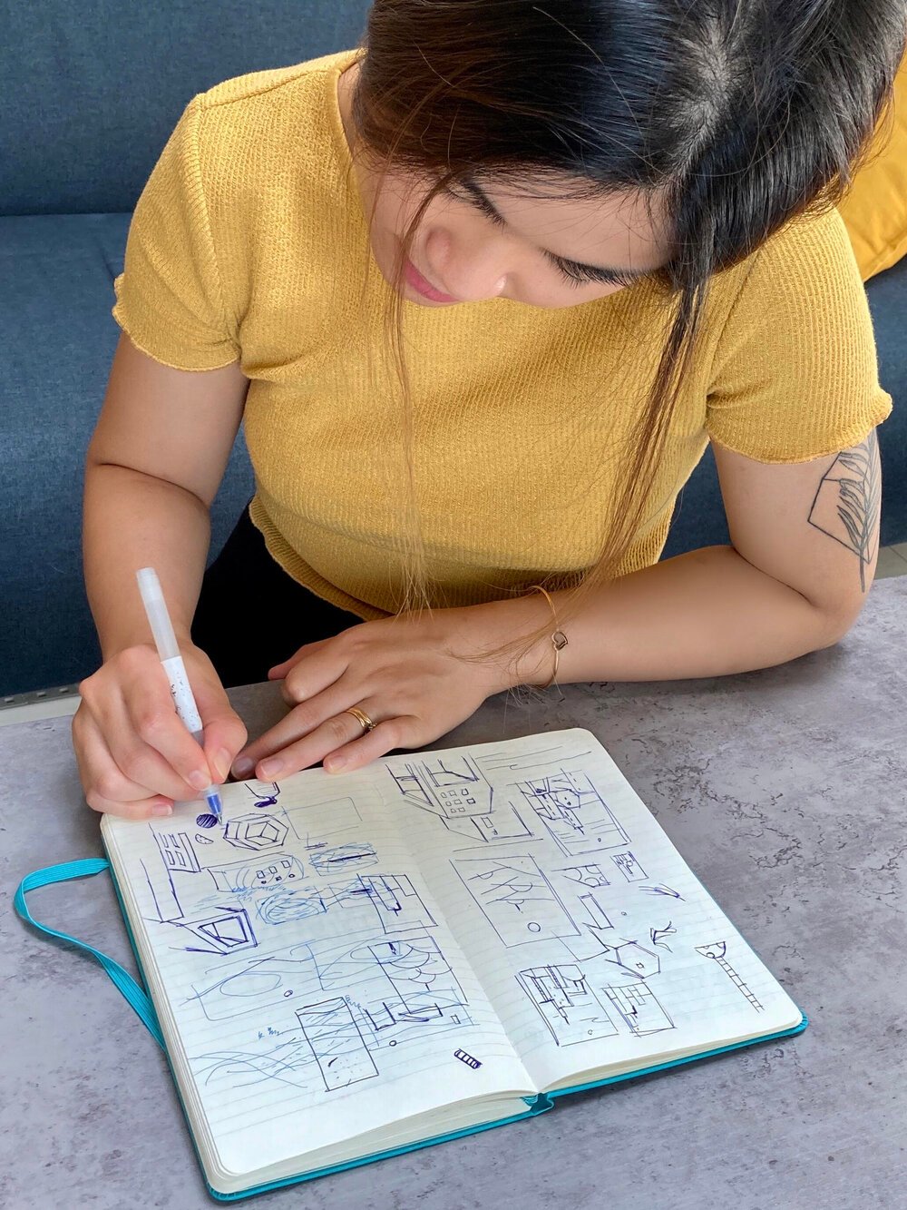 Yukai Du working on her Moleskine Studio Notebook