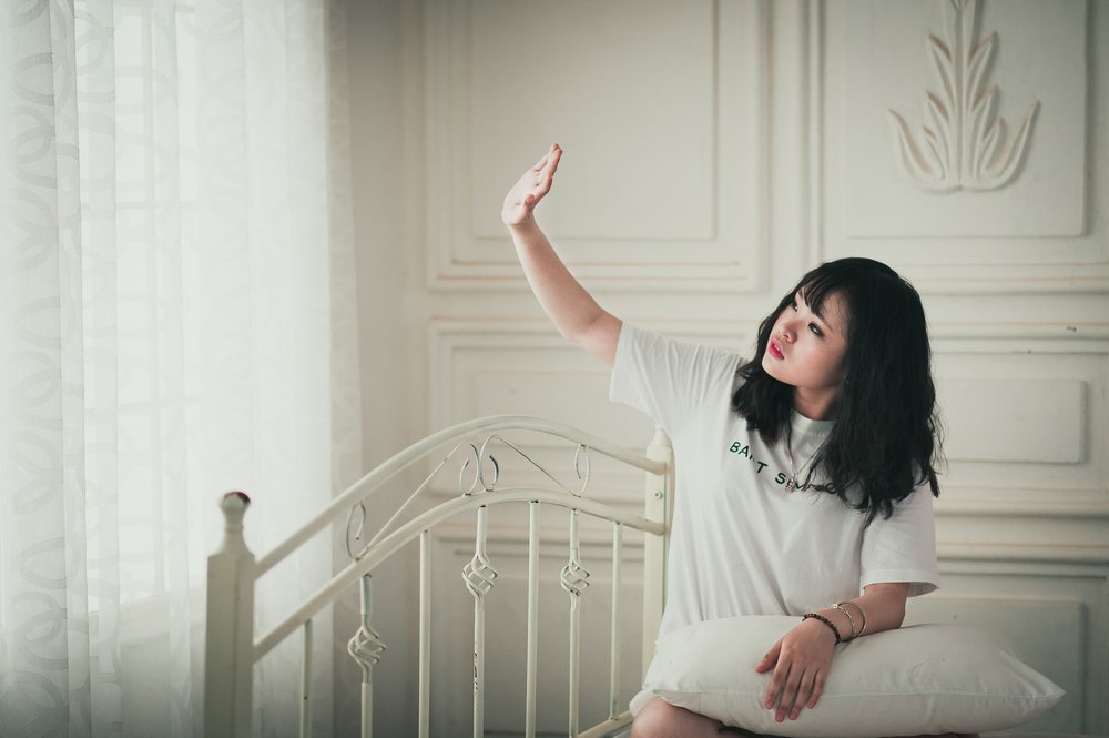 By positioning subjects by a window, you can create beautiful, naturally-lit portraits indoors ( image source )