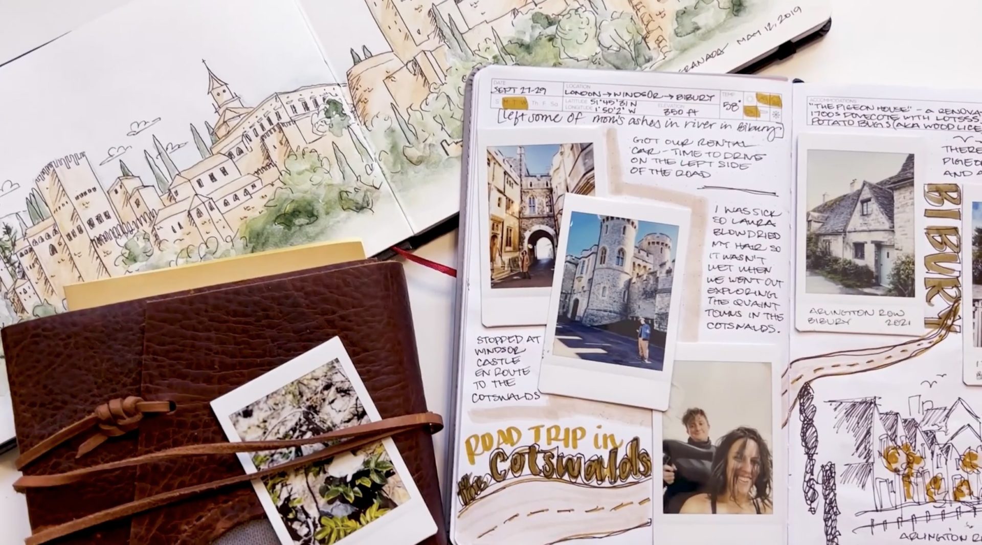Several of teacher Peggy Dean’s journals lay open on a white backdrop. One features a two-page illustration of a town from a distance. The other includes Polaroid photos and journaling.