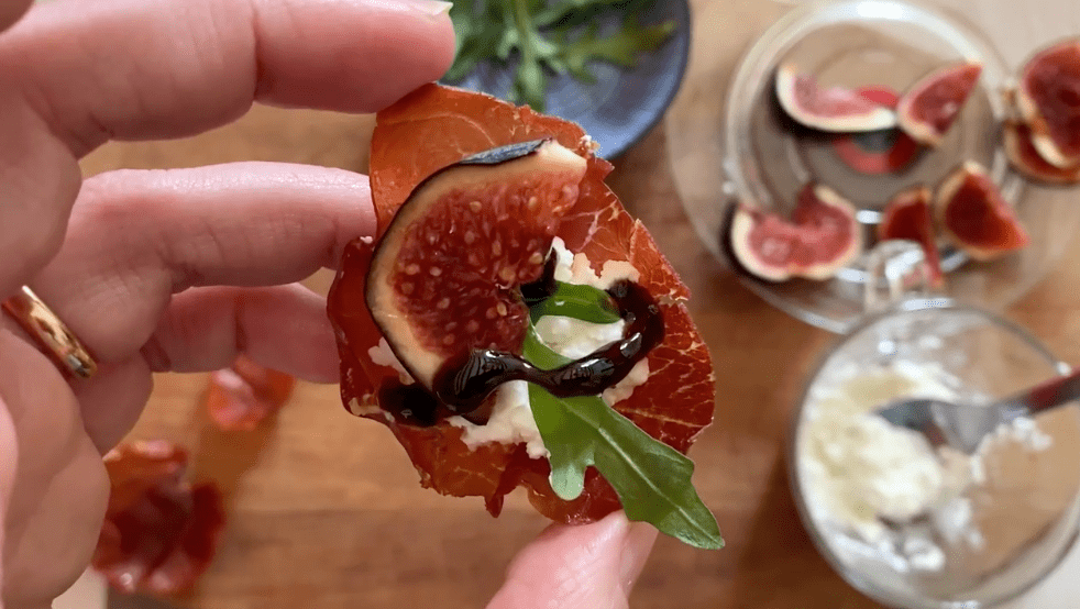 Prosciutto, figs and arugula being served as a gluten free Thanksgiving starter.