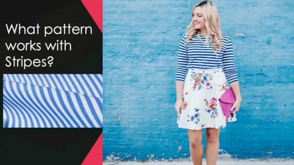 A blonde woman wearing a white skirt with flowers, a blue and white striped long-sleeved shirt and carrying a hot pink clutch smiles in front of a blue brick wall. To the left of the image is a graphic that reads “What pattern works with stripes?”
