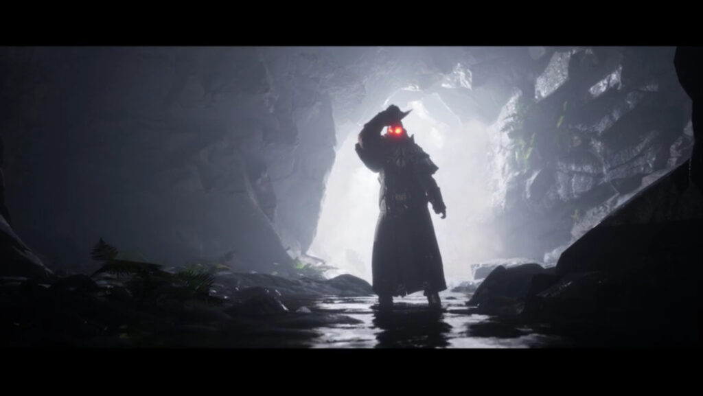 A three-dimensional depiction of a cloaked figure with glowing red eyes standing in a dark cave. The cave’s opening is positioned just behind the figure, sharply silhouetting its outline.