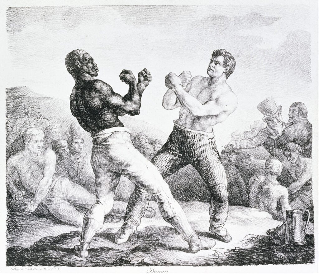Two shirtless men stand at odds with their fists up. The white man leans to the right and the black man, who's back is to us, leans to the left. They are standing on a circular raised dirt area and men in top hats and fancy clothe sbut also shirtless stand around watching and gesturing. The whole picture is in black and white and you can see the fine line work of all the shading.