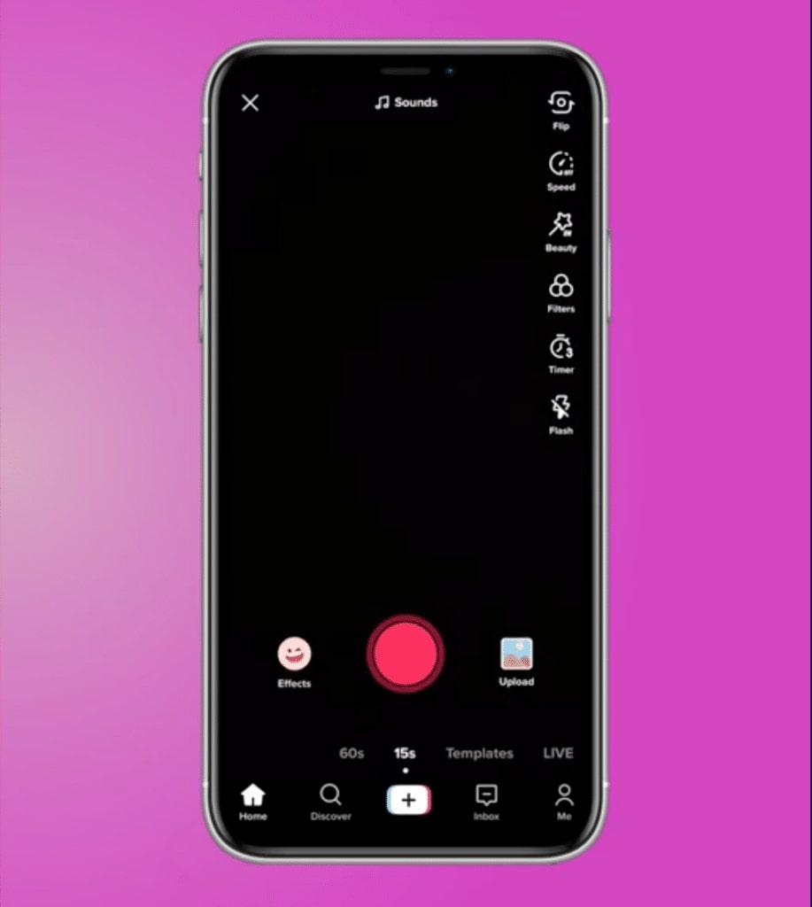 A phone on a purple background shows the recording screen within TikTok. The camera view is black, but the “Effects,” “Upload” and “Record” buttons are all visible at the bottom of the screen as well as the navigation bar.