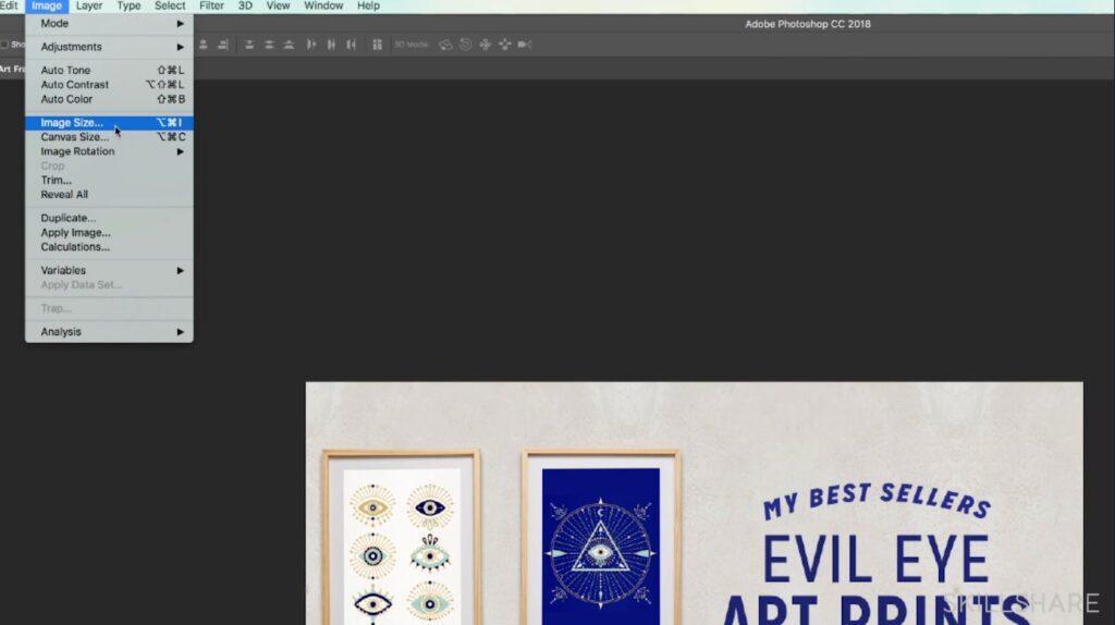 Adobe Photoshop 2018 is open to a rectangular project with “My Best Sellers Evil Eye Art Prints” written on it. To the left of the text are two wooden framed art prints with geometric evil eye art prints within them. At the top of the screen, the user has opened the “Image” menu and is selecting the “Image Size” option. 