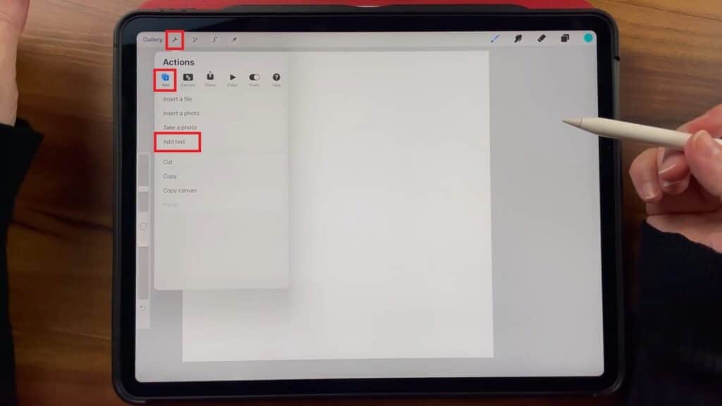 Skillshare instructor Jennifer Nichols has the Procreate app open on the iPad and demonstrates how to add a new textbox onto a blank canvas.