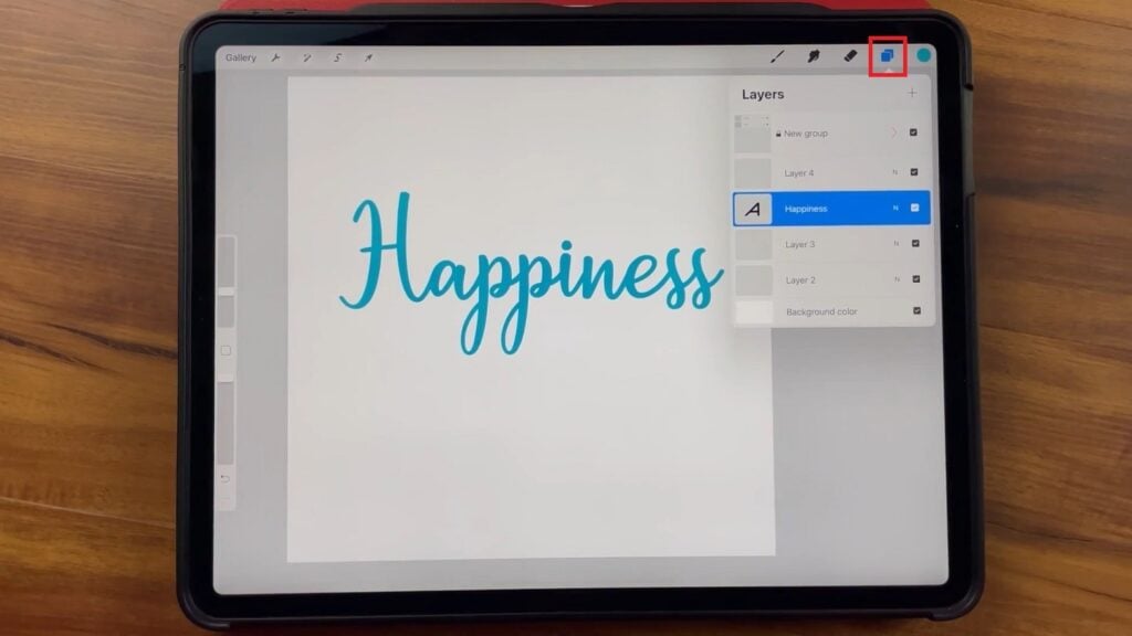 Nichols has the Procreate app open on the iPad, demonstrating how to view layers and rearrange them.