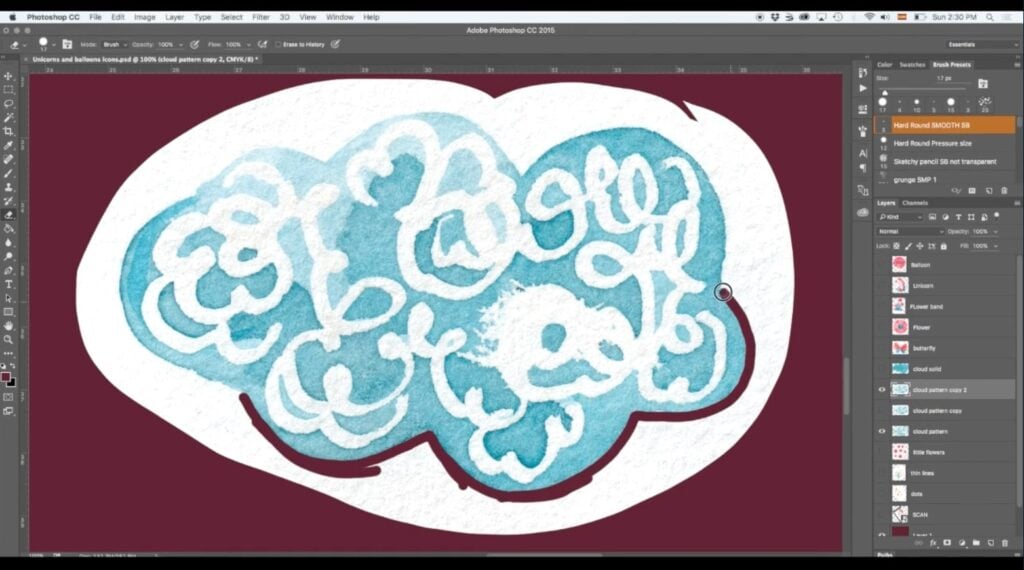 An abstract blue watercolor cloud sits on a white oval, which sits on a maroon background within Photoshop. The Photoshop user is using the eraser to separate the cloud from the white oval. A black outline of a circle can be seen, representing the user’s cursor, as well as a maroon outline around the cloud, representing where the user has already erased.