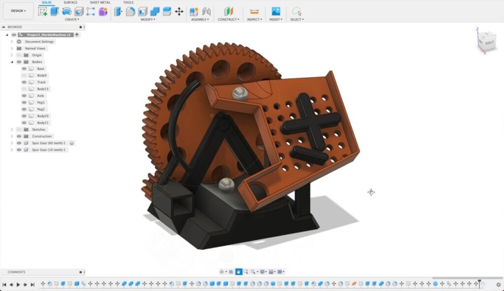 A 3D design of a marble machine is open in Fusion 360. 
