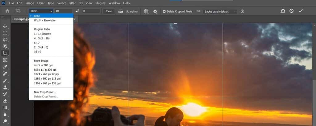 The sunset photo is open in Photoshop. The top of the screen shows a toolbar where it’s possible to adjust things like aspect ratio, size and resolution and overlay options. 