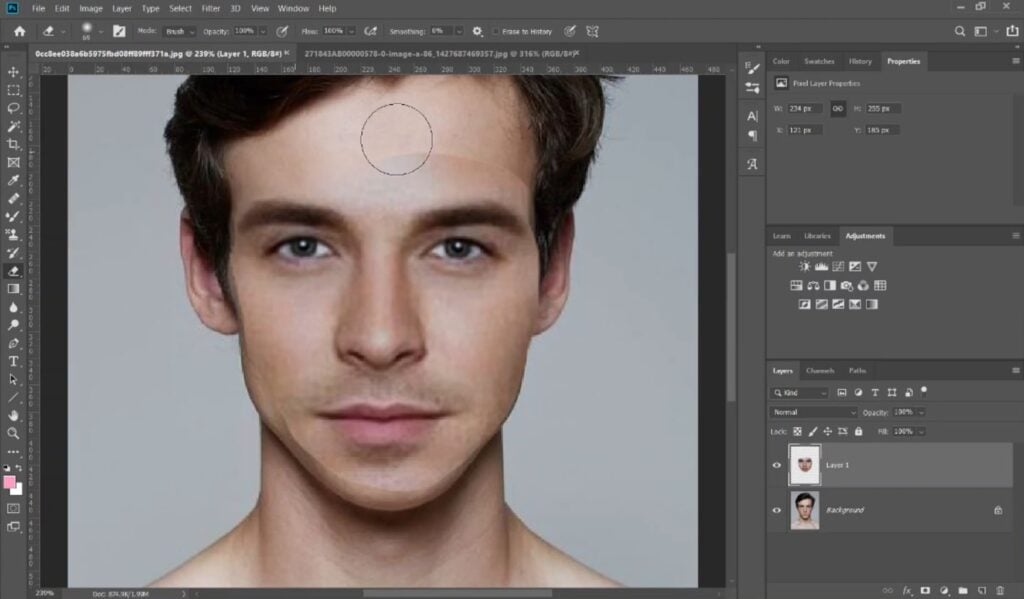 In Photoshop, a user moves the eraser tool over the edge between a new face and the original body it’s pasted on top of.
