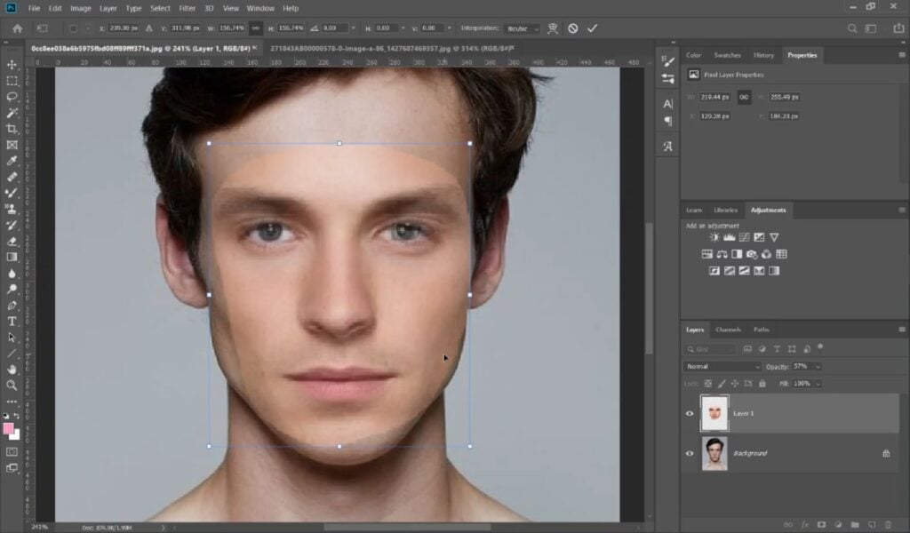 In Photoshop, a user reduces the opacity of a cutout face in order to precisely align it on top of another portrait. 