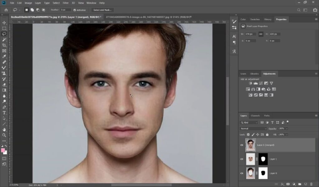 In Photoshop, a face is seamlessly blended onto a body from another portrait.
