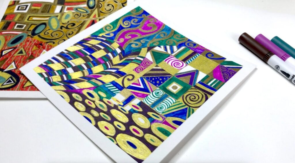 Two square pieces of white paper filled with geometric shapes decorated with gold accents. 