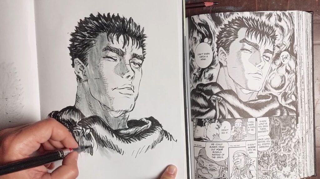 A person using a pen to draw a portrait that closely resembles one from a manga. The manga they’re using as reference is visible to the right of the drawing.
