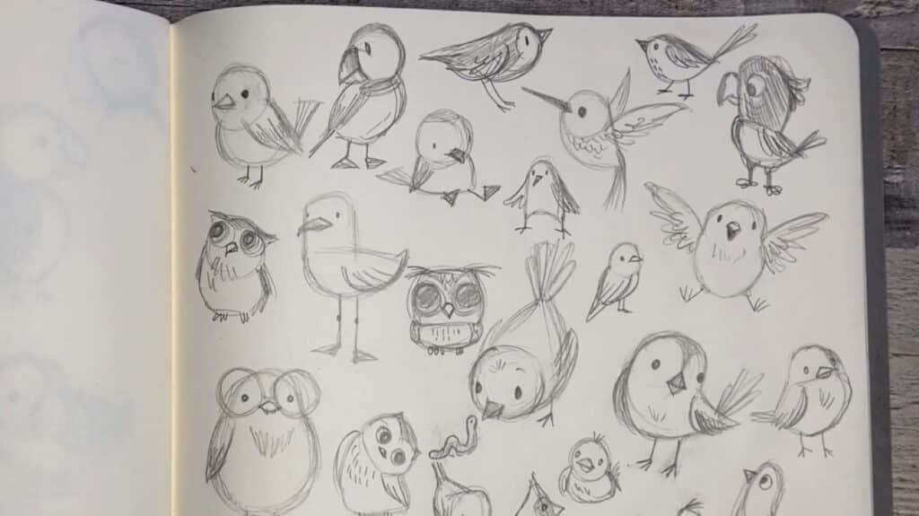 A page of an open sketchbook that’s been filled with pencil drawings of birds in various poses. 