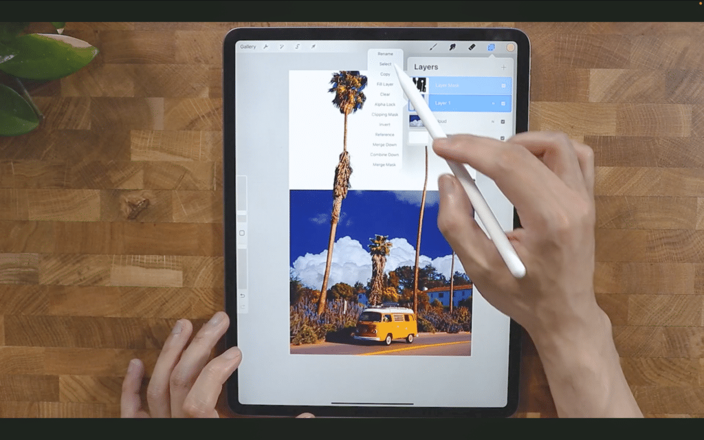 An iPad with the Procreate app open, featuring a poster design mid-workflow.