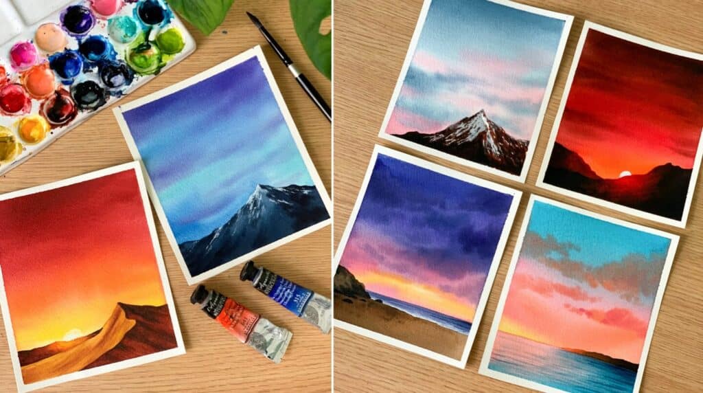 Two photos arranged side by side. Both show watercolor sunset and sky paintings laid out on a brown wooden surface. The paintings use vibrant colors like orange, purple, blue and red, and several contain mountains in the foreground.