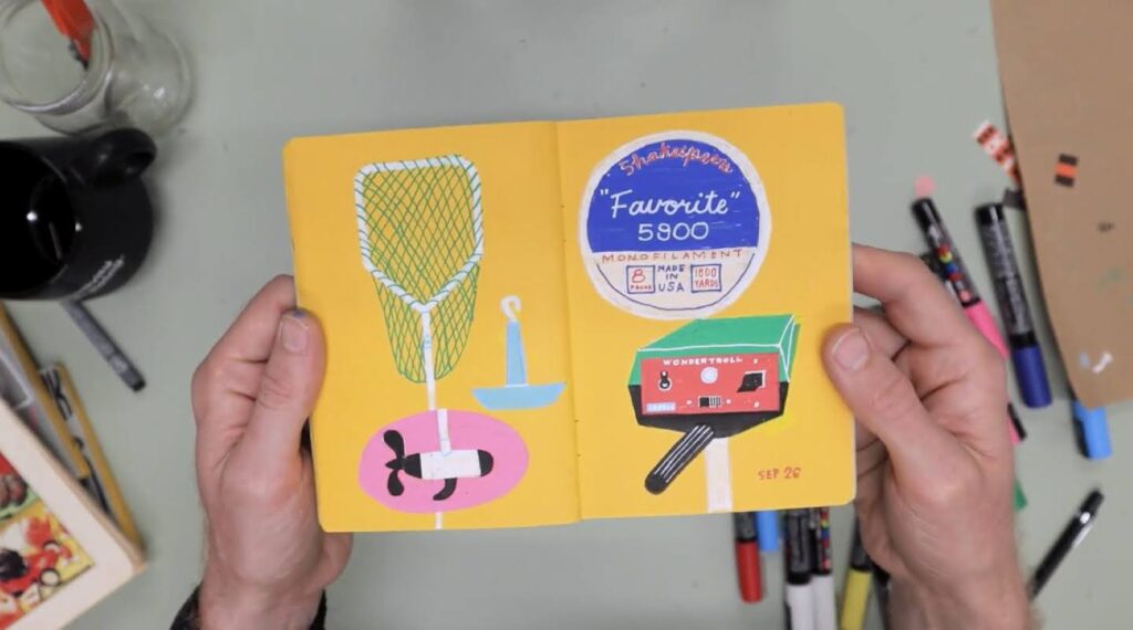 A person’s hands holding a sketchbook open. Its pages are filled with brightly colored illustrations of fishing-related items, including a net and a package of filament.