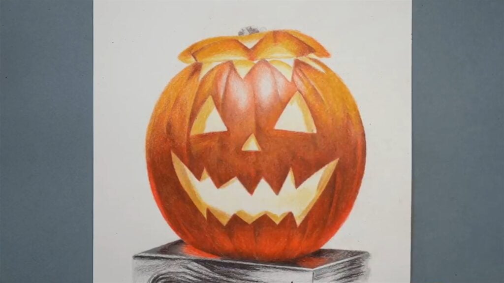 Drawing of a classic jack-o-lantern with triangle nose and eyes and a jagged smile full of sharp teeth