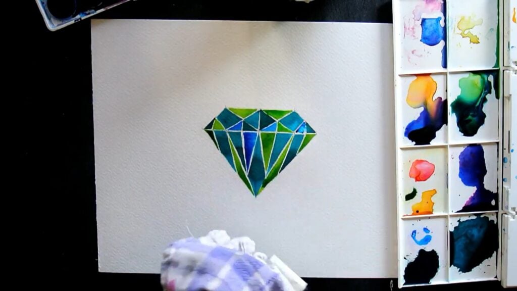 Painting of a cut diamond in all different blues and greens, surrounded by a palette and cloth