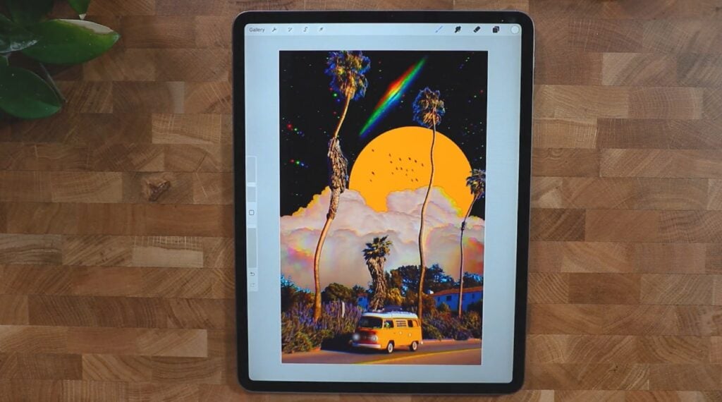 An iPad laying on a wooden tabletop. The screen is displaying a surreal image of a camper van parked on the street under wavy palm trees with clouds and multi-colored stars visible in the sky.